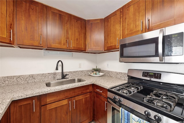 475 Atkinson Dr Unit 709, Honolulu, HI 96814 - kitchen with brown cabinets, appliances with stainless steel finishes, light stone countertops, and a sink