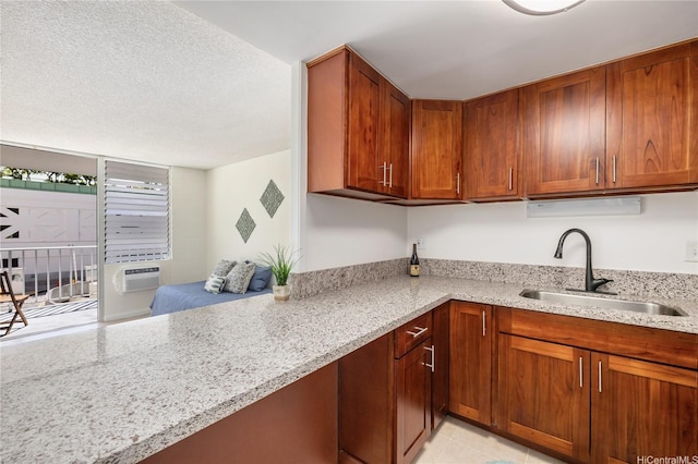 475 Atkinson Dr Unit 709, Honolulu, HI 96814 - kitchen featuring light stone countertops, cooling unit, a sink, and brown cabinets