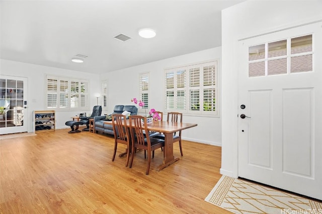 dining space featuring light hardwood / wood-style floors