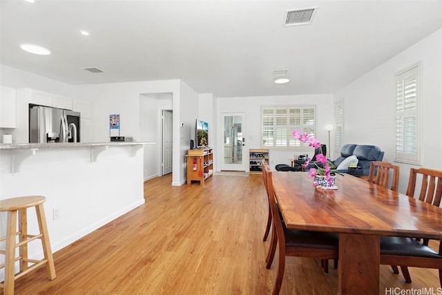 dining space featuring light hardwood / wood-style flooring