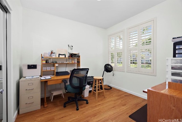 office area with light wood-type flooring