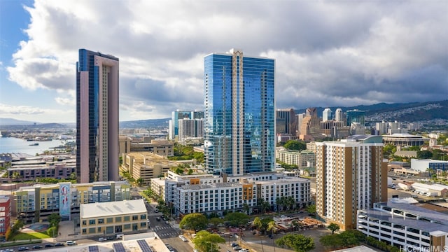 property's view of city featuring a water and mountain view