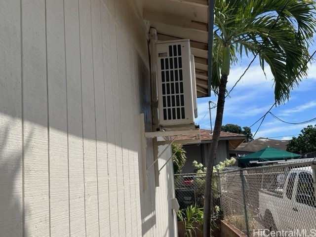 view of side of property featuring ac unit