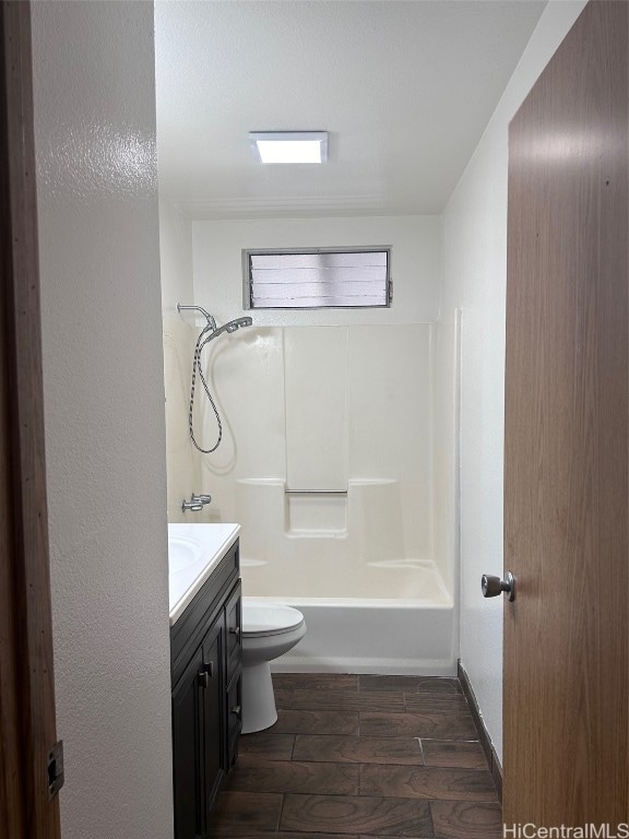 full bathroom with toilet, bathing tub / shower combination, vanity, and wood-type flooring