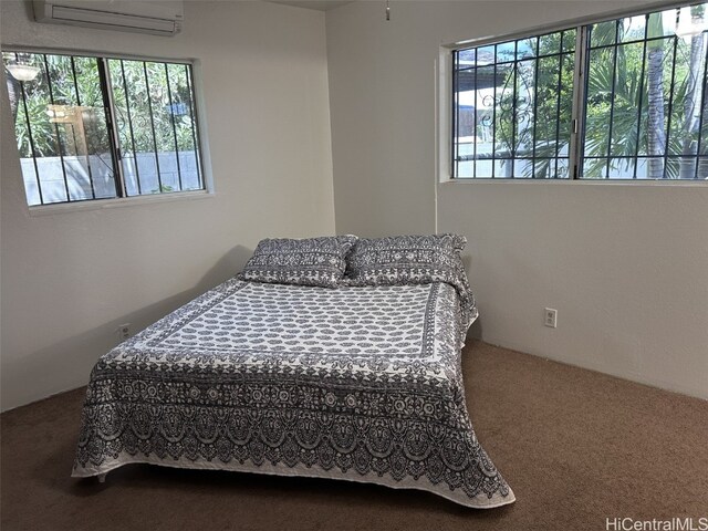 bedroom featuring an AC wall unit and carpet flooring