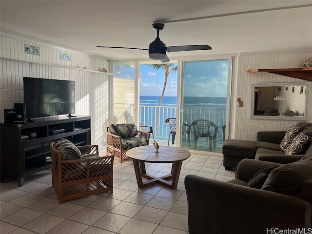 tiled living room with ceiling fan