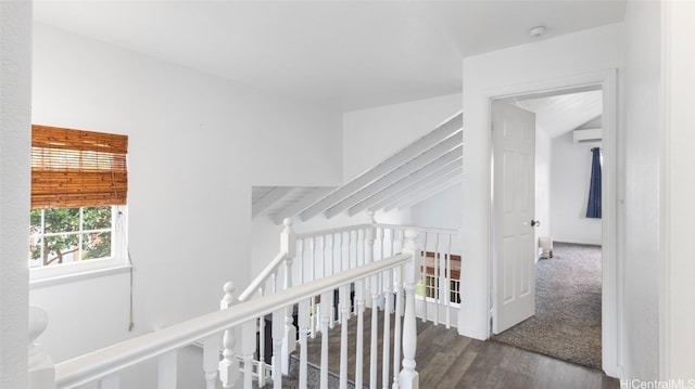 hall featuring dark hardwood / wood-style floors and beamed ceiling