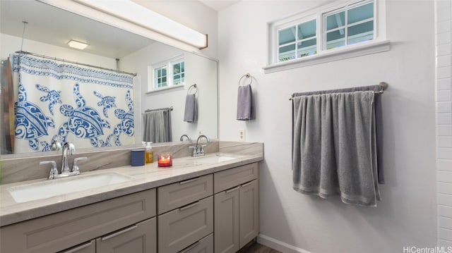 bathroom with vanity and curtained shower