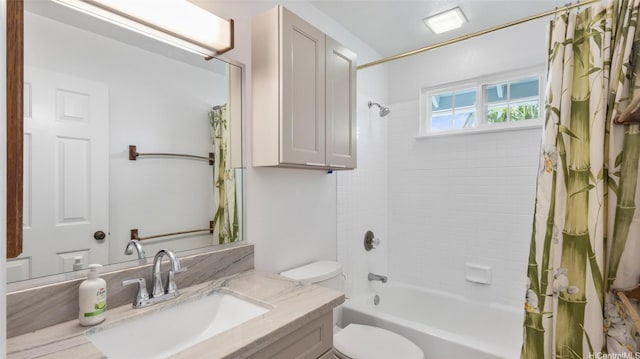 full bath with vanity, shower / bath combo with shower curtain, and toilet