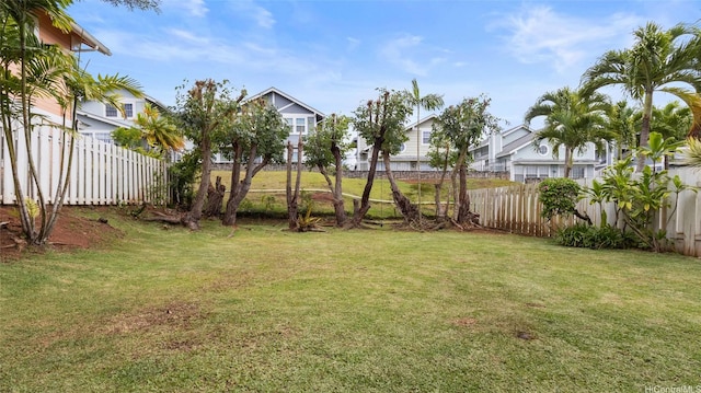 view of yard with fence and a residential view
