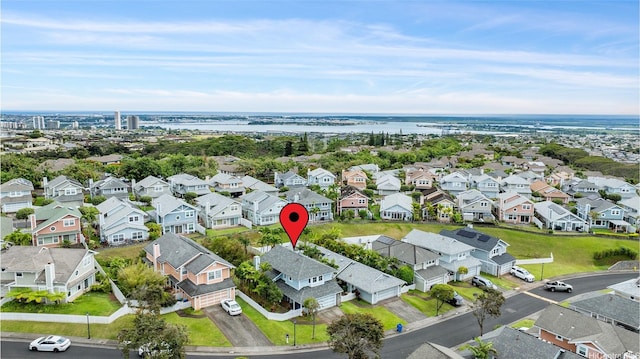 drone / aerial view with a water view and a residential view