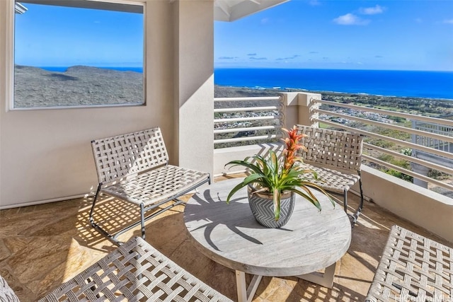 balcony featuring a water view