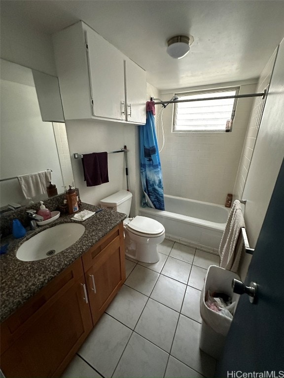 full bathroom with vanity, toilet, shower / bath combination with curtain, and tile patterned flooring