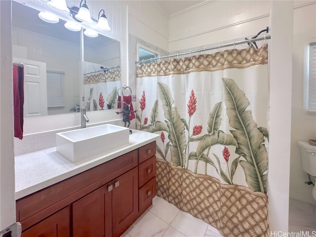 bathroom featuring tile patterned floors, toilet, crown molding, vanity, and walk in shower