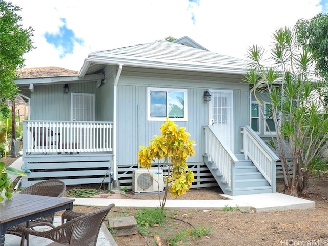 view of front of home with ac unit