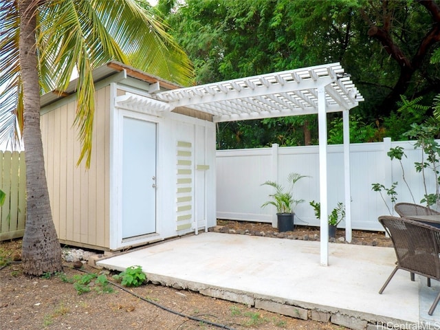 view of outdoor structure with a pergola