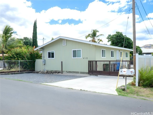 view of property exterior with a deck