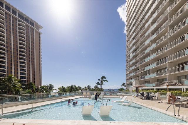 view of swimming pool with a patio