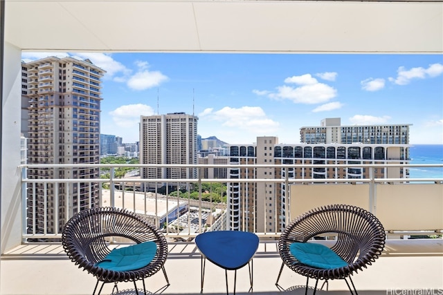 balcony featuring a water view