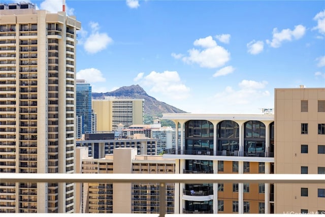 property's view of city featuring a mountain view