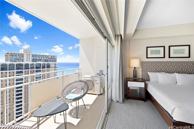 balcony featuring ac unit and a water view