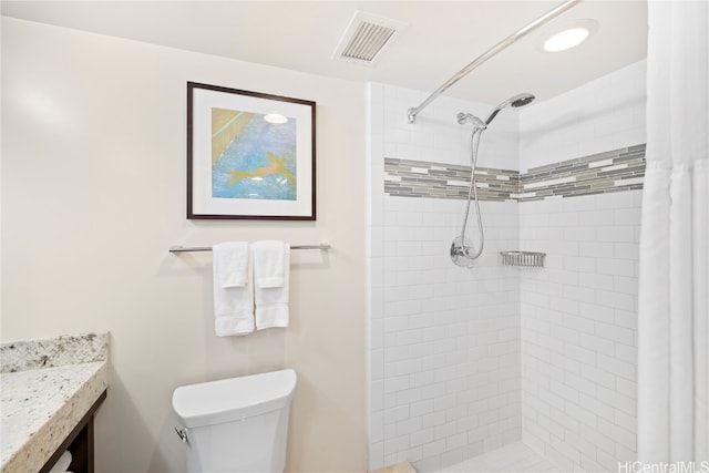 bathroom with vanity, a shower with curtain, and toilet