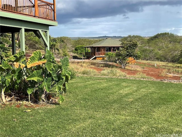 view of yard with a wooden deck