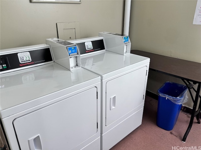 laundry room featuring carpet flooring and separate washer and dryer