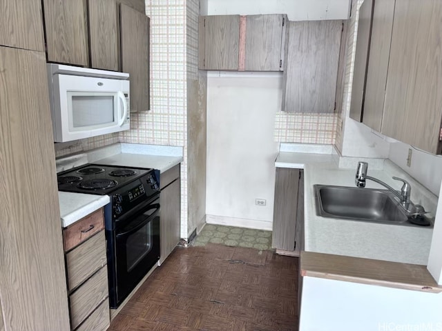 kitchen featuring sink, black electric range oven, dark parquet flooring, and tasteful backsplash