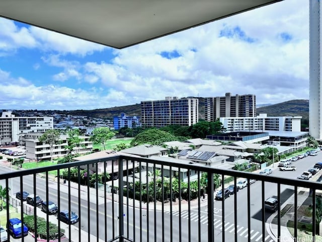 balcony featuring a mountain view