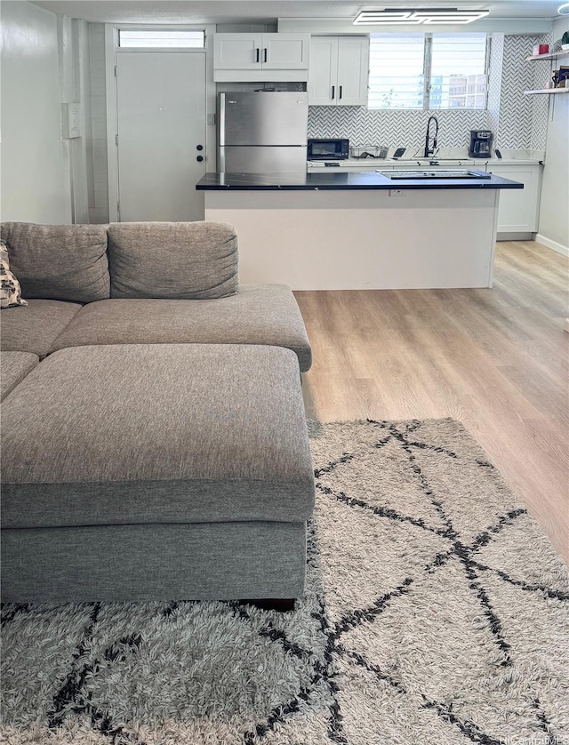 225 Liliuokalani Ave Unit 5C, Honolulu, HI 96815 - living area featuring light wood-style floors