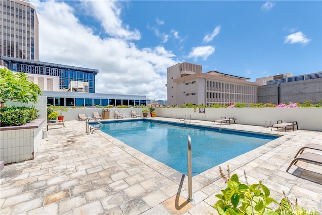 view of swimming pool with a patio