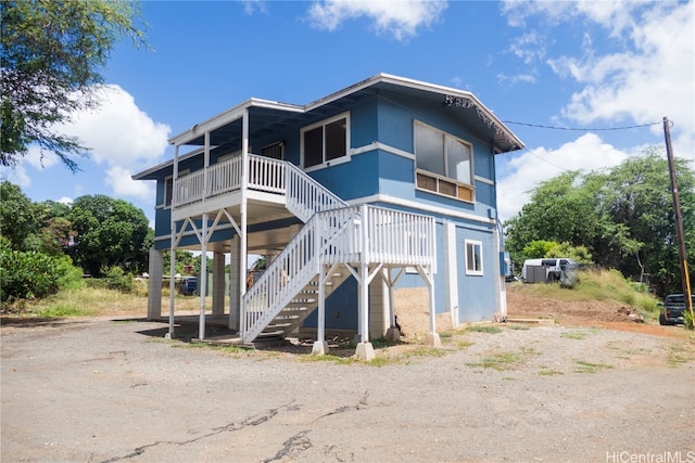 rear view of house with a porch