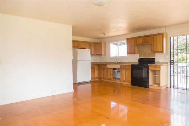 kitchen with white fridge, black range with electric cooktop, sink, and stainless steel dishwasher