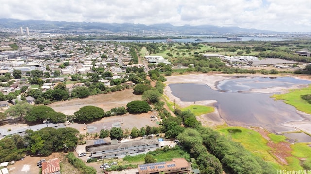 aerial view featuring a water and mountain view