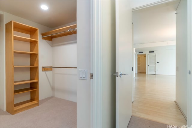 spacious closet with light hardwood / wood-style floors