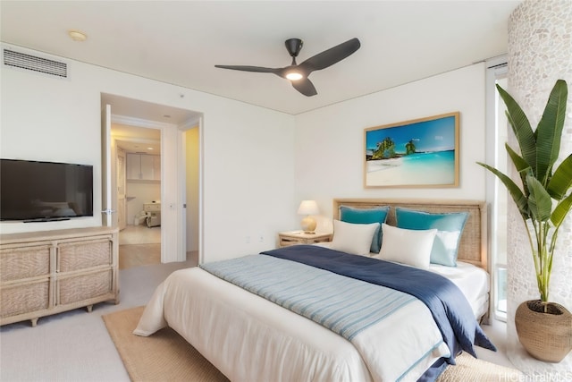 bedroom featuring light carpet and ceiling fan