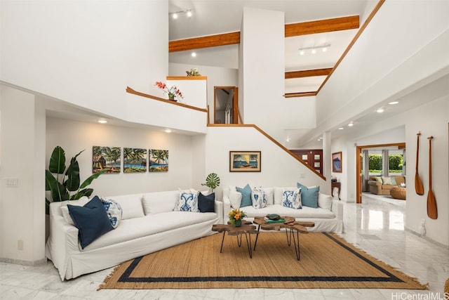 living room featuring beam ceiling