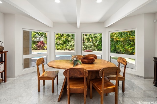 dining area with beamed ceiling