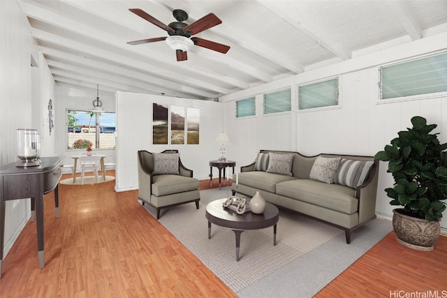 living room with vaulted ceiling with beams, hardwood / wood-style flooring, and ceiling fan