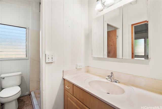 bathroom with vanity, toilet, and tile patterned floors