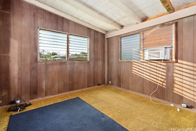 carpeted spare room with cooling unit, wood walls, beamed ceiling, and wood ceiling