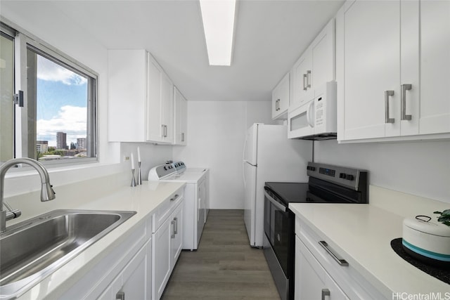 kitchen with dark wood-type flooring, independent washer and dryer, sink, white cabinets, and electric stove