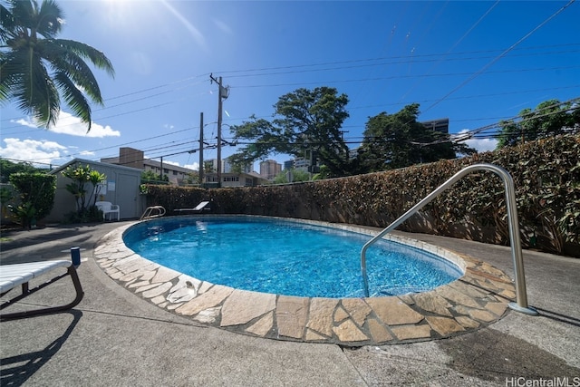 view of swimming pool with a patio