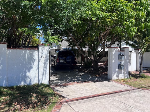 view of gate featuring fence