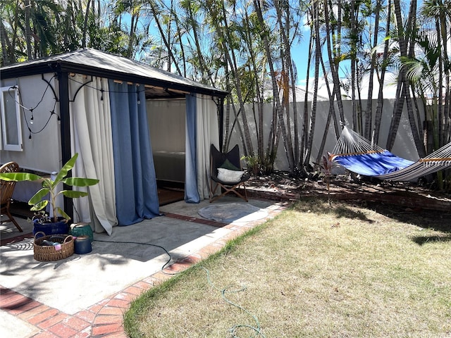 view of yard with a gazebo and fence