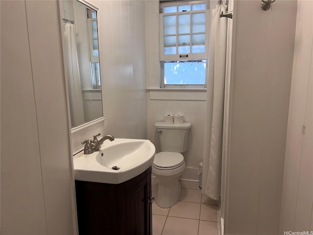 full bathroom featuring tile patterned flooring, vanity, and toilet