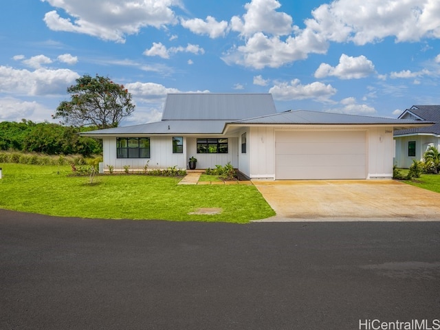 ranch-style house featuring covered porch, a garage, and a front lawn