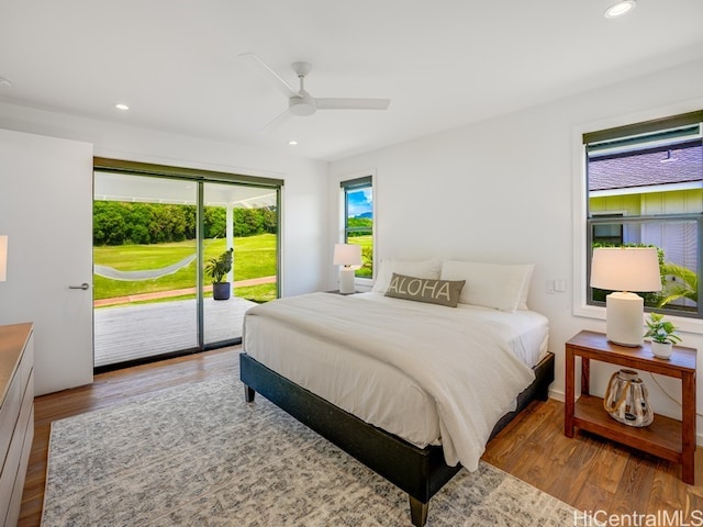 bedroom with light wood-type flooring, access to outside, and ceiling fan