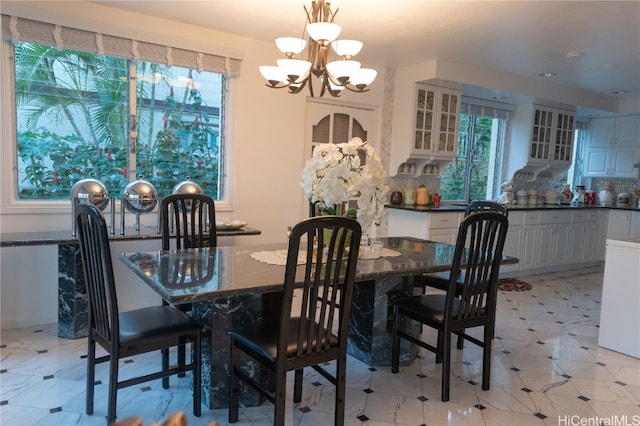 dining space with a chandelier